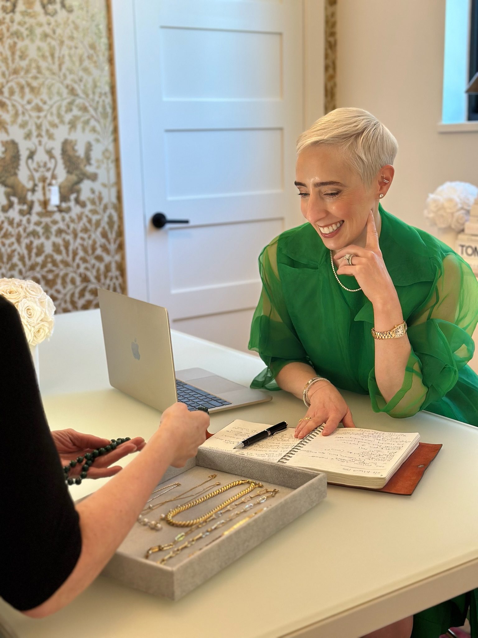 Denise Junell Johnson in a green blouse at a consultation table